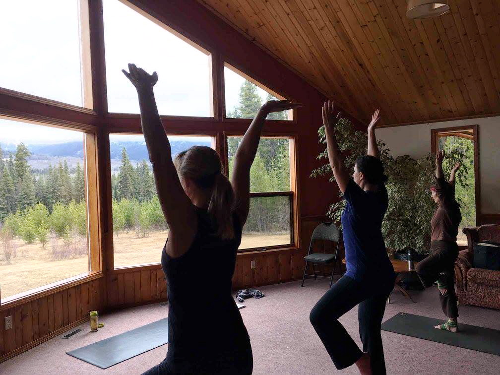 Name, Tammy Rancourt, and Suzanne Ross salute the morning drizzle. Photo and yoga facilitation by Amanda Follett Hosgood